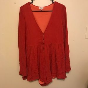 Flowy orange long sleeve romper